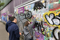 Signing the "Peace Wall"in Belfast